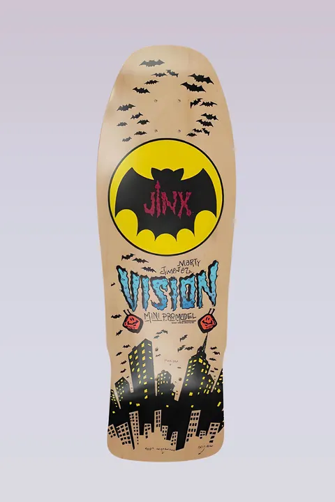 Vision Street Wear Jinx - Mini Modern Concave - Yellow skateboard deck: Yellow bat-signal style circle holding a black bat marked 'Jinx', surrounded by swarming bats, above Vision lettering in blue and a black city skyline with lit windows. Natural wood deck.