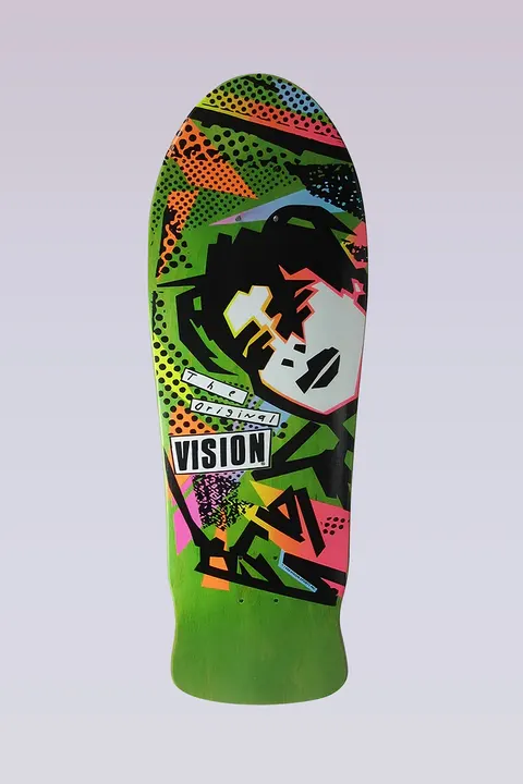 Vision Street Wear MG - Modern Concave - Lime skateboard deck: Old-school Vision graphic on lime green stain: an abstract black-haired head with a pale mask-like face amid angular black shapes, halftone dots and neon pink, orange and yellow blocks. A The Original Vision tag sits at the lower left.