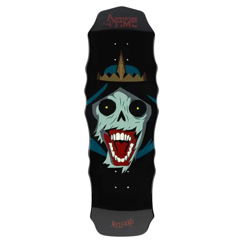 Welcome ADVENTURE TIME X WELCOME - The Lich on Widow skateboard deck: Screaming pale-green skull face with round black eyes and a red open mouth, wearing a hood and a gold spiked crown. Adventure Time logo at the nose, on a black wavy-edged shape.