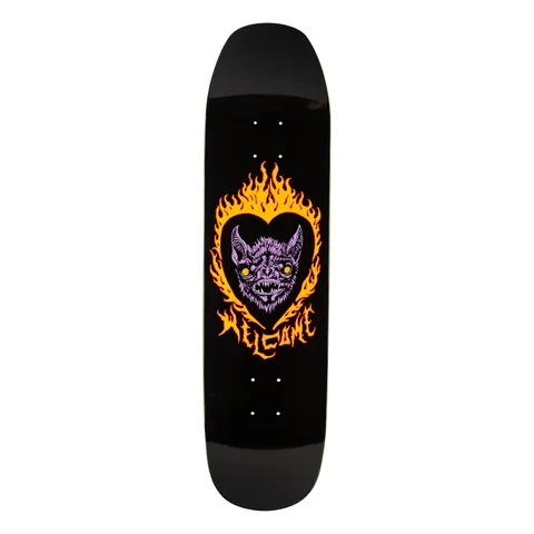 Welcome Blood Sucker on Son of Moontrimmer - Black - 8.25 skateboard deck: Purple vampire bat face with yellow eyes and fangs inside a black heart, ringed by orange and yellow flames, on a black deck with a flaming Welcome logo beneath. Shaped deck with a flat, squared nose.