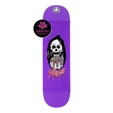 Welcome Clairvoyant on Evil Twin - Purple - 8.5 skateboard deck: Purple deck showing a hooded skull in a black oval holding a glittery crystal ball in a skeletal hand with red nails. Orange-red Welcome script lettering sits beneath, with the Welcome emblem at the nose.