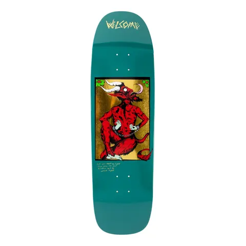 Welcome Krampus on Golem - Forest - 9.25 skateboard deck: A red horned Krampus with a long curled tongue sits chained at the wrists in a gold-foil framed panel, with holly in the corners. A short handwritten verse is below it, and the Welcome logo is at the top of the teal deck.