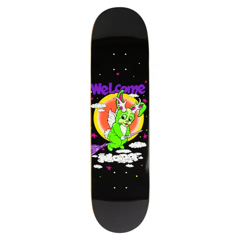 Welcome Nora Vasconcellos Full Moon on Popsicle - Black skateboard deck: Cartoon green bunny with antlers and angel wings riding a purple broomstick across a night sky of stars and clouds, in front of a glowing orange moon. Purple Welcome logo above and rider name in the clouds below.