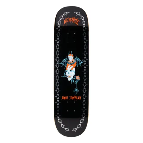 Welcome Ryan Townley Angel on Enenra - Black/Silver Foil - 8.5 skateboard deck: Red and white winged devil figure with a bat wings perched on a skull with a rose in its teeth and a spider hanging below, between silver chain borders on black. Welcome gothic lettering at top.