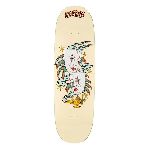 Welcome Wish on Boline 2.0 - Bone - 9.5 skateboard deck: Two white theatre masks, one smiling and one crying, held by green clawed hands amid blue smoke and gold stars, rising from a golden genie lamp. Cream background with a red-brown flame-style Welcome logo at the top.