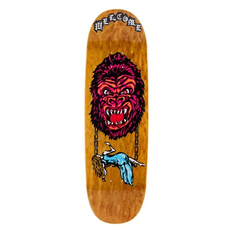 Welcome Wonder on Boline 2.0 - Light Brown Stain - 9.5 skateboard deck: Magenta and orange snarling gorilla head hangs from two chains above a limp woman in a blue dress, on a light brown wood-stained shaped deck. Gothic blackletter Welcome logo at the nose.
