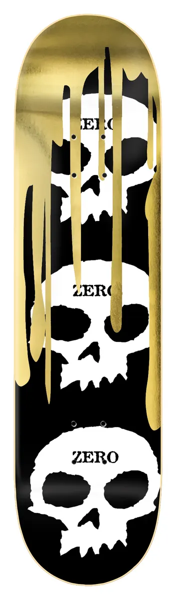 Zero 3 Skull Blood - Gold Foil skateboard deck: Three stacked white Zero skulls on black, each labelled with the brand name, with gold foil drips running down from the top.