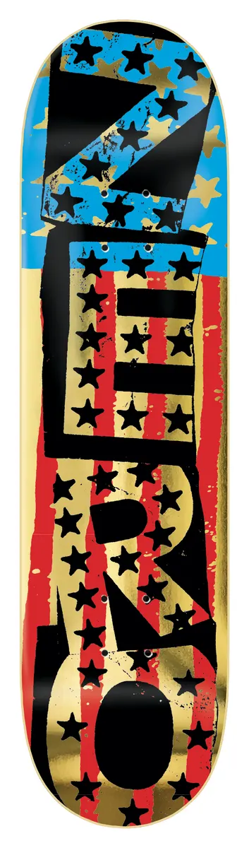 Zero American Punk - Gold (Black Dip) skateboard deck: Large stencil-style 'ZERO' lettering running vertically over a stars-and-stripes pattern, with black stars on gold foil and red and blue stripes. Black dipped edges.