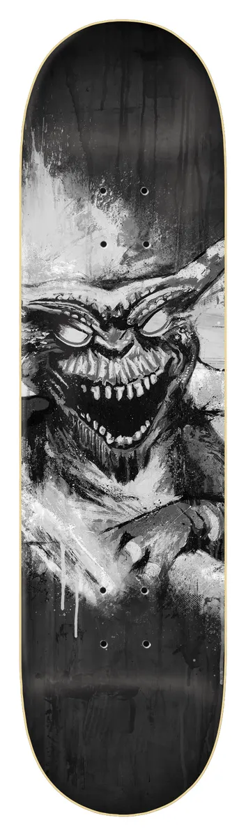 Zero Burman - Gremlin 8.25 skateboard deck: Black and white painted, splattered image of a snarling gremlin-like creature with large ears, glaring eyes and jagged teeth, with white streaks and black drips around it.