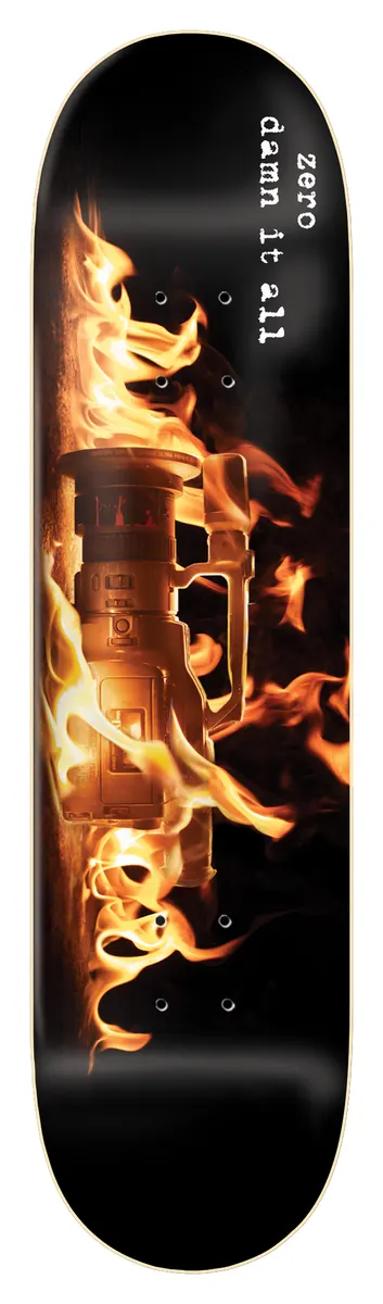 Zero Damn It All - Vx skateboard deck: A photograph of a video camcorder engulfed in flames on a black deck. White typewriter-style text runs down the upper part.