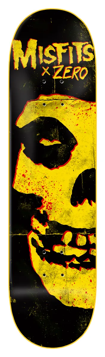 Zero Fiend Skull - Yellow Dipped skateboard deck: Black deck with Misfits x Zero lettering in yellow at the top above a large cropped yellow Fiend skull with red blood splatters, with a yellow edge dip.