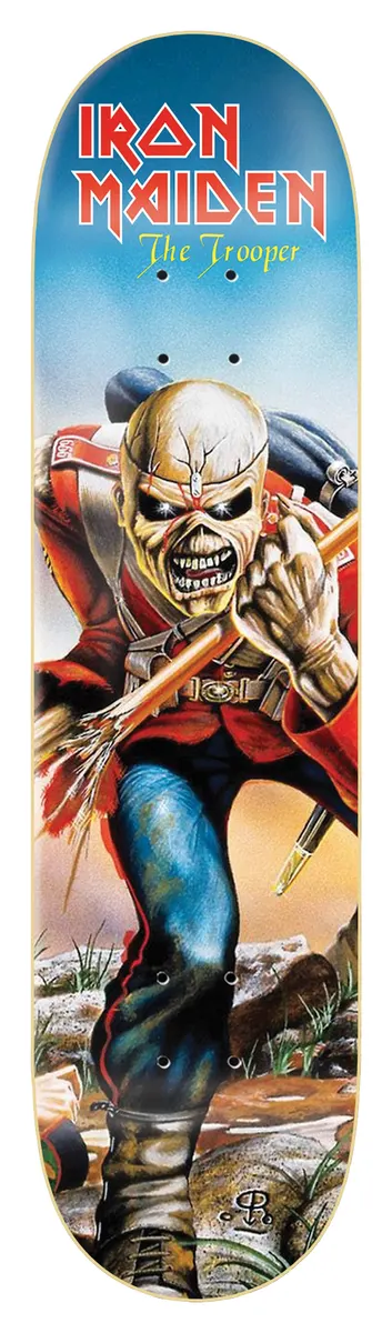 Iron Maiden Iron Maiden - The Trooper 8.25 skateboard deck: Painted illustration of Iron Maiden's skeletal mascot Eddie as a British redcoat soldier charging forward with a tattered flag, over a blue sky and rocky ground. Band name and song title in red and yellow lettering across the top.