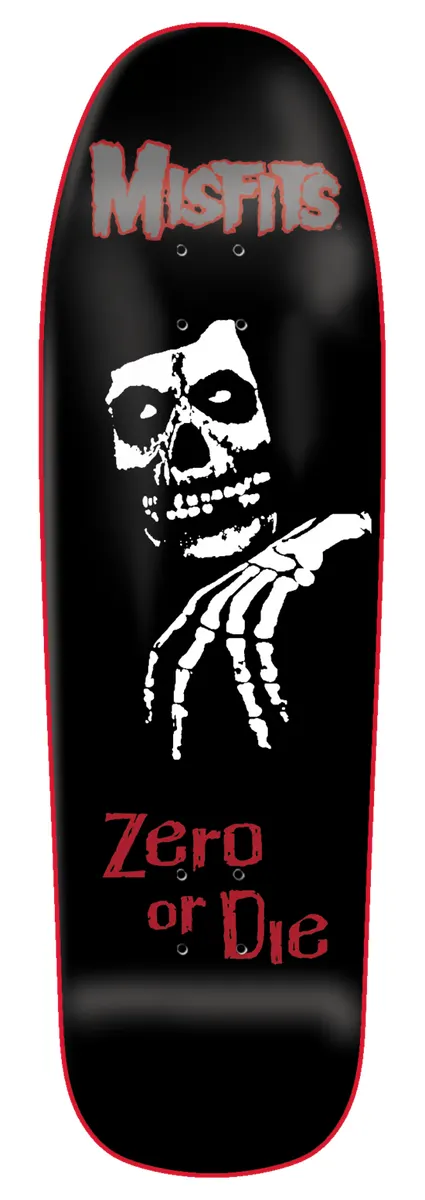 Zero Legacy - 9.5 skateboard deck: Old-school shaped black deck with a red outline, a grey MISFITS logo above a white skull face and skeletal hand, and ZERO OR DIE in red lettering below.
