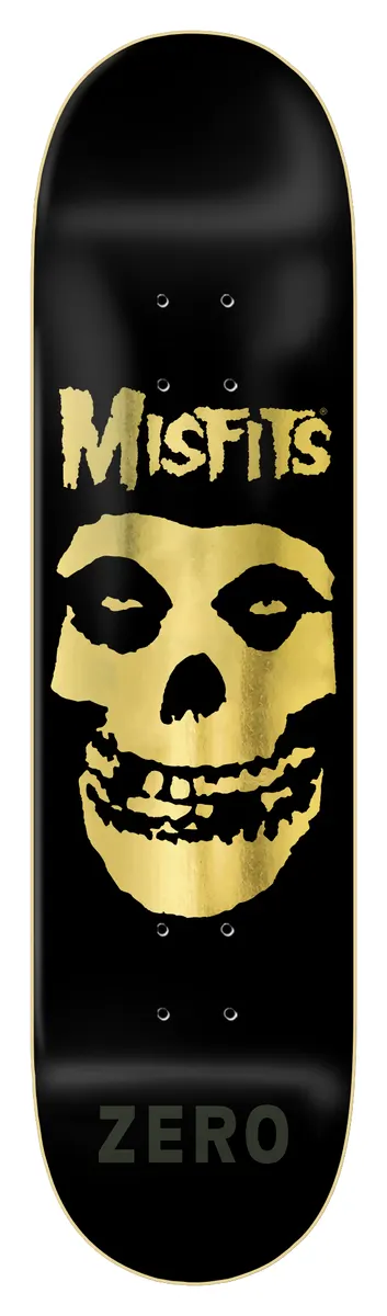 Zero Misfits Fiend Skull - Gold Foil Edition skateboard deck: Black deck with a gold foil Misfits Fiend Skull face in the centre, a gold Misfits logo above it and a dark Zero wordmark near the tail.