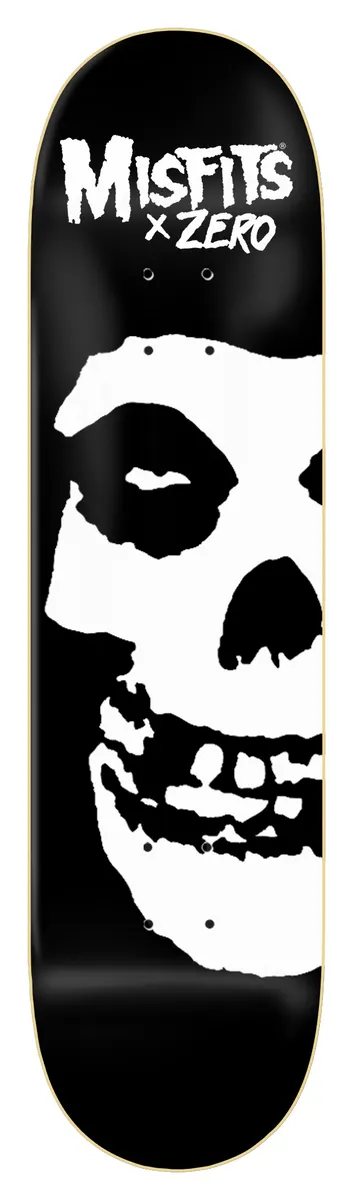 Zero Misfits Fiend Skull - Hand - Screened - Black/White skateboard deck: Black deck with a huge white Misfits Fiend Skull face filling the lower half, cropped at the right edge, under a white Misfits x Zero logo at the top.