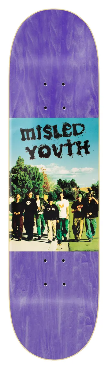 Zero Misled Youth 8.25 - Purple skateboard deck: Colour photo panel across the middle of a purple-stained deck showing a group of young men in dark clothes walking along a path past trees under a blue sky, with Misled Youth in a scratchy black hand-drawn font above them.