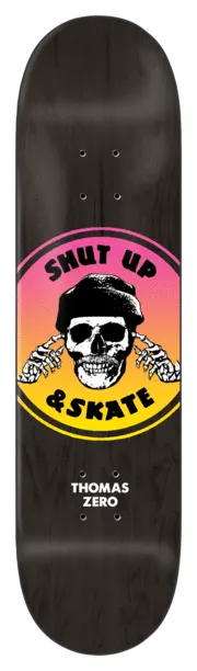 Zero 2 Tone Shut Up & Skate - Thomas skateboard deck: A round badge with a pink to yellow gradient shows a skull in a beanie with skeletal hands over its ears, circled by the words Shut Up and Skate, on a black stained deck. Rider surname and brand are printed below.