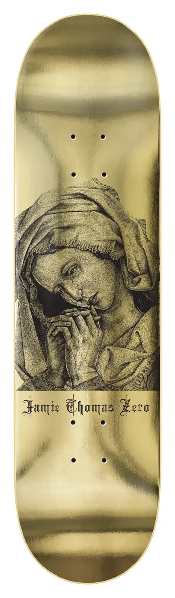 Zero Thomas - Mary Magdalene skateboard deck: Engraved portrait of a veiled woman with hands clasped in prayer, her head bowed, above gothic-script lettering, on a metallic gold deck.